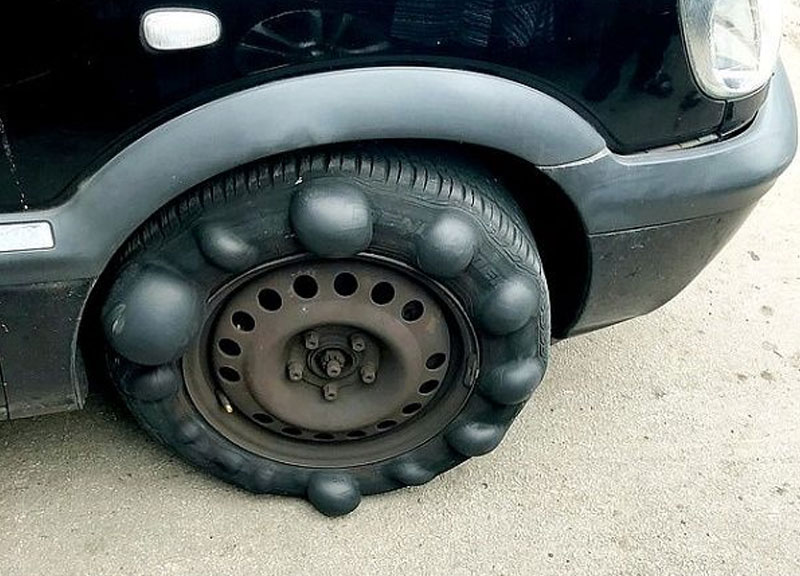 Auto Repair Shops Bad Parts Photo - Lumpy Tires